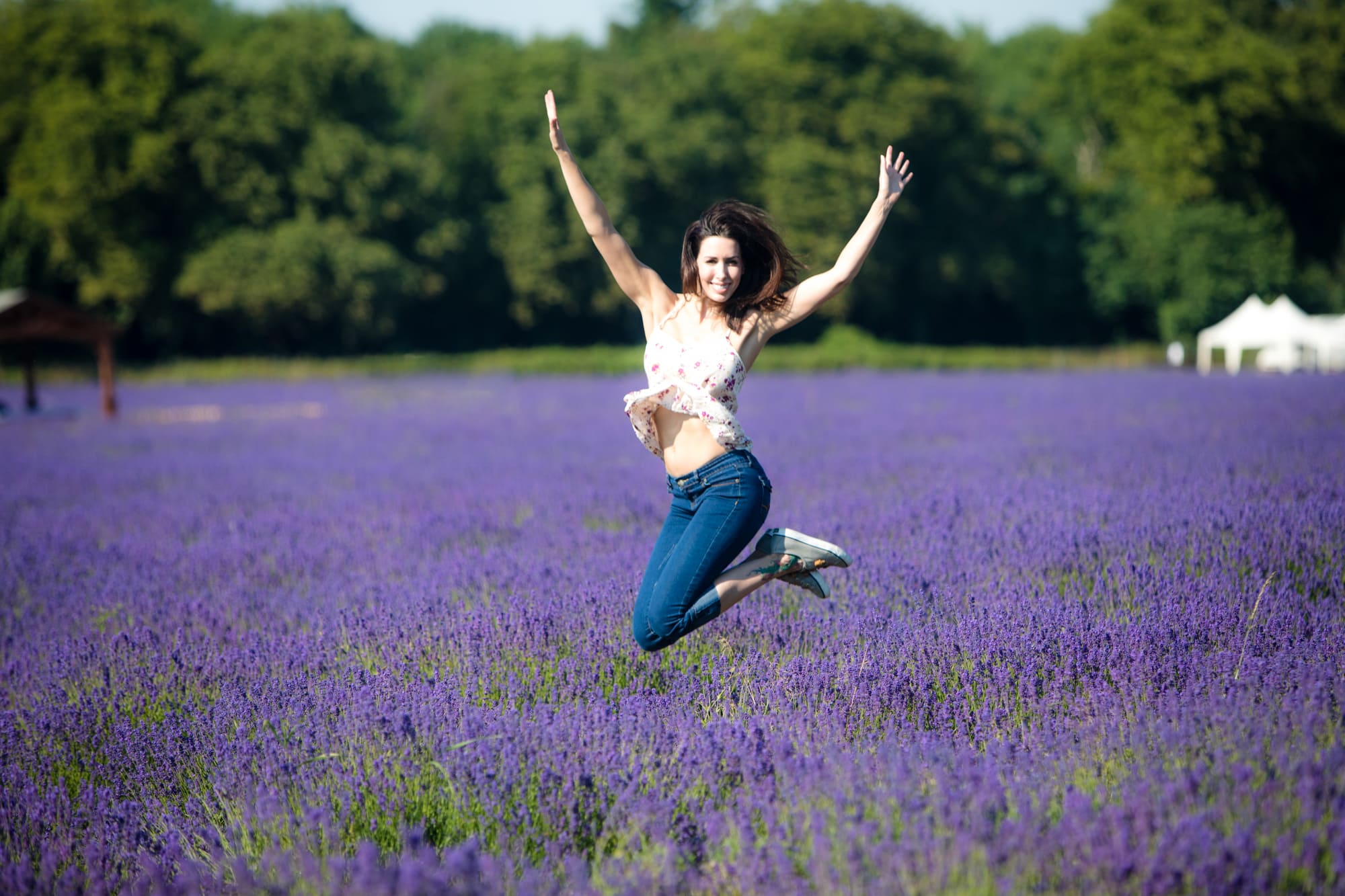woman jumping in lavender fields
